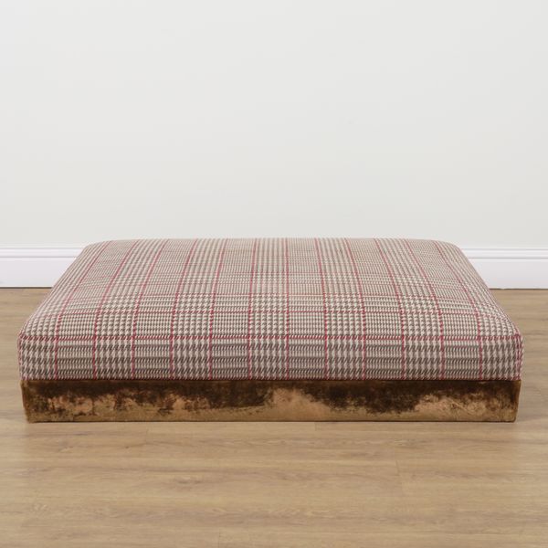 A MODERN UPHOLSTERED RECTANGULAR FOOTSTOOL