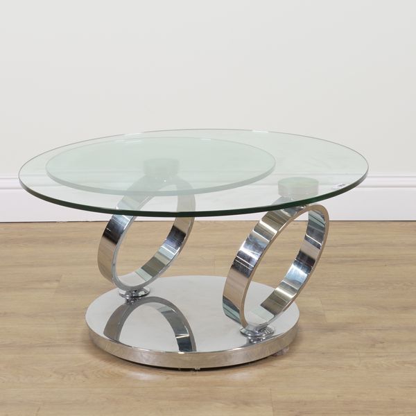 A MODERN CHROME AND GLASS METAMORPHIC DUAL CIRCULAR GLASS TOP TABLE