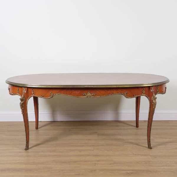 AN 18TH CENTURY STYLE FRENCH GILT METAL MOUNTED OVAL MAHOGANY DINING TABLE