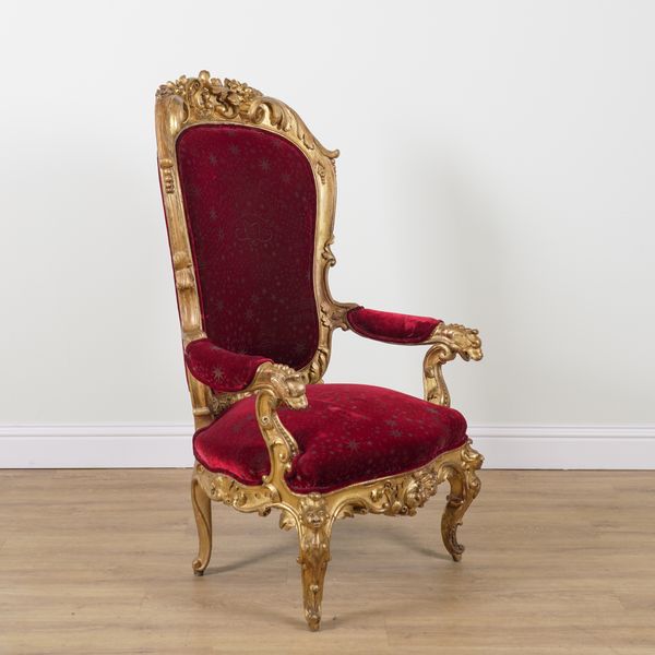 A 19TH CENTURY VENETIAN LARGE CARVED GILT FRAMED OPEN ARMCHAIR