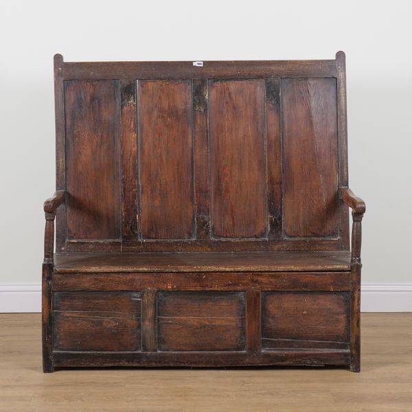 A 19TH CENTURY PINE FOUR PANEL BACK OPEN ARM BOX SEAT SETTLE