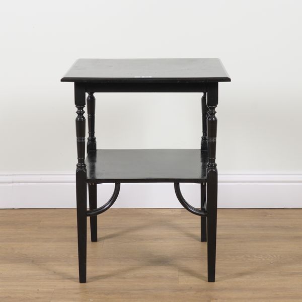 AFTER GODWIN; AN EARLY 20TH CENTURY EBONISED SQUARE TWO TIER OCCASIONAL TABLE