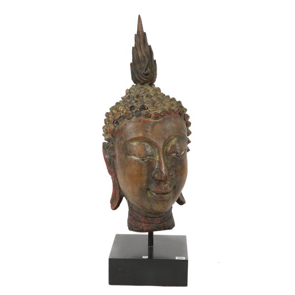 A THAI POLYCHROME HEIGHTENED CARVED WOOD HEAD OF BUDDHA