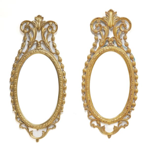 BRIGHTS OF NETTLEBED; A PAIR OF 18TH CENTURY STYLE GILT FRAMED OVAL MIRRORS (2)