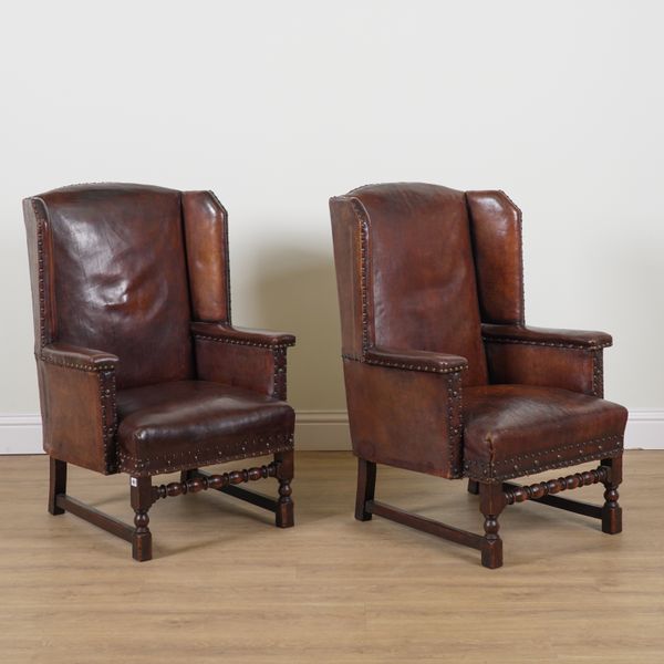 A PAIR OF VICTORIAN LEATHER WINGBACK ARMCHAIRS (2)