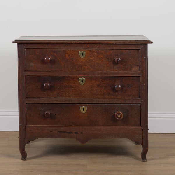 AN 18TH CENTURY CONTINENTAL OAK THREE DRAWER COMMODE