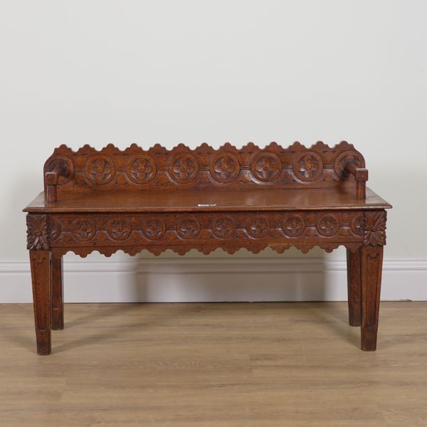 A VICTORIAN CARVED OAK LOW HALL BENCH