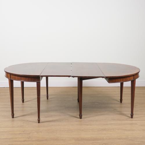 A GEORGE III MAHOGANY D-END EXTENDING DINING TABLE