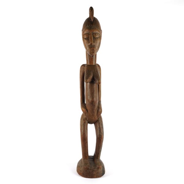 TRIBAL INTEREST, A CARVED FIGURE, BLOBLO BLA