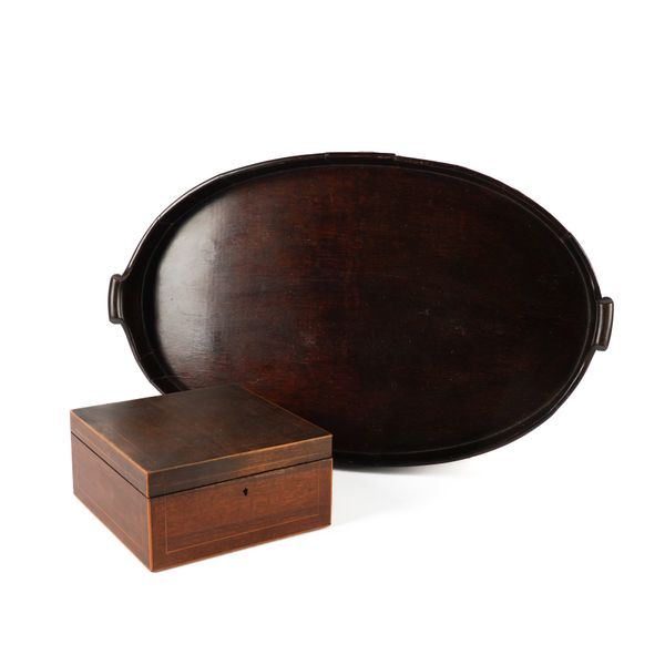 A GEORGE III MAHOGANY BRASS BOUND OVAL SHAPED TRAY (2)