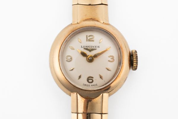 A LONGINES 9CT GOLD LADY'S BRACELET WRISTWATCH