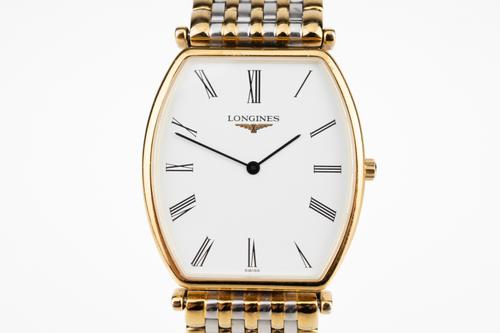 A LONGINES STEEL AND GILT METAL GENTLEMAN'S BRACELET WRISTWATCH AND ANOTHER WATCH (2)