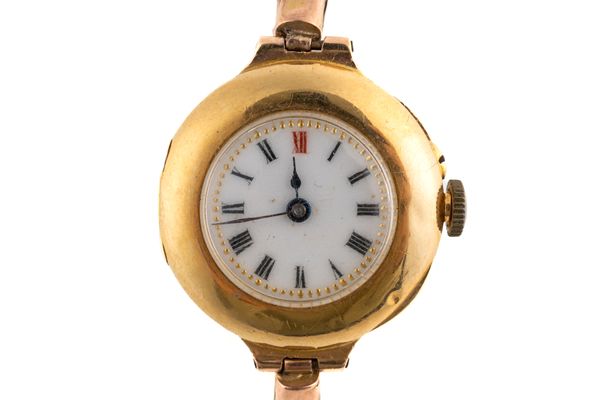 A GOLD CIRCULAR CASED LADY'S WRISTWATCH