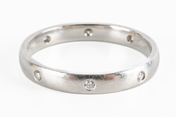 A PLATINUM AND DIAMOND WEDDING RING