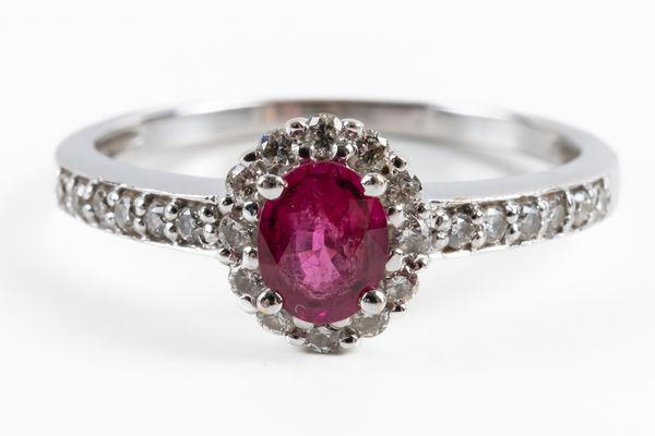 A WHITE GOLD, RUBY AND DIAMOND CLUSTER RING