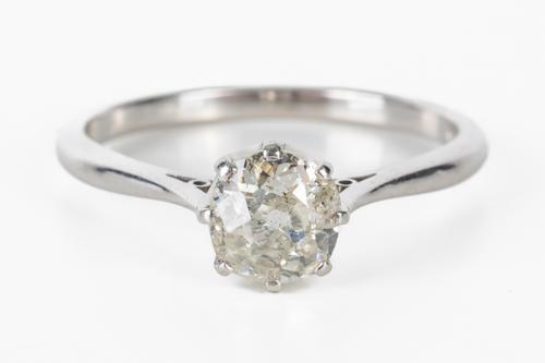 A PLATINUM AND DIAMOND SINGLE STONE RING