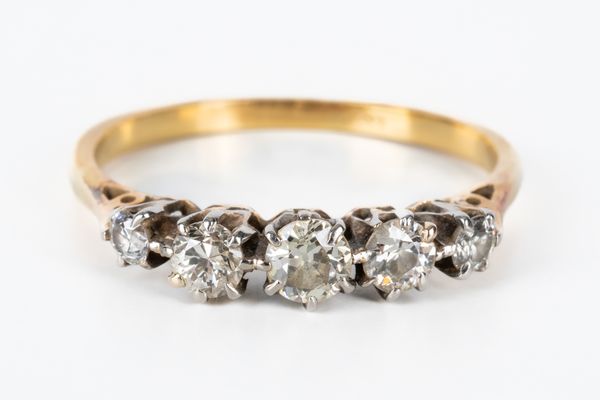 A GOLD AND DIAMOND FIVE STONE RING