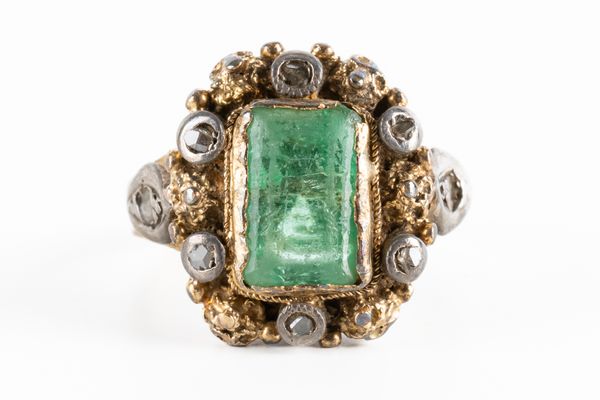 AN EMERALD AND DIAMOND CLUSTER RING