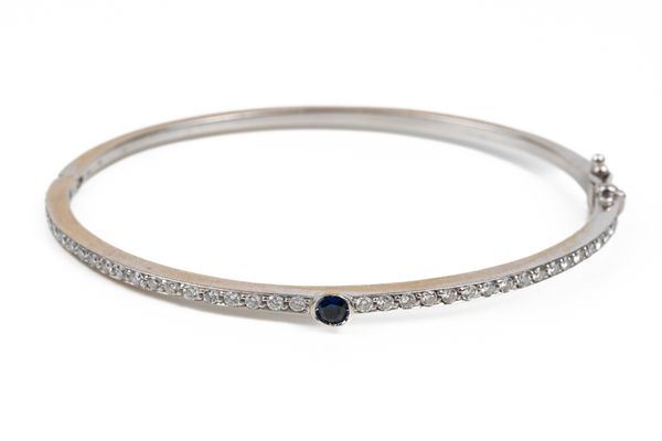 A BLUE SAPPHIRE AND DIAMOND BANGLE