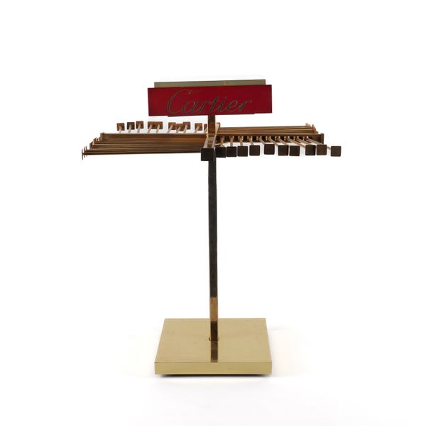 CARTIER: A GILT LACQUERED METAL DISPLAY STAND