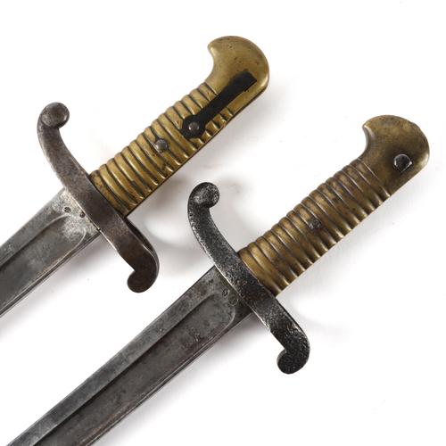 A 19TH CENTURY FRENCH BAYONET WITH SCABBARD AND BRASS HANDLE (2)