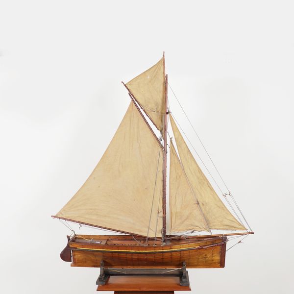 A CARVEL PLANKED MODEL OF A GAFF RIGGED YACHT