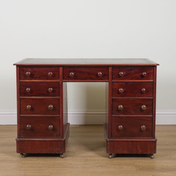 A SMALL 19TH CENTURY MAHOGANY NINE DRAWER KNEEHOLE WRITING DESK