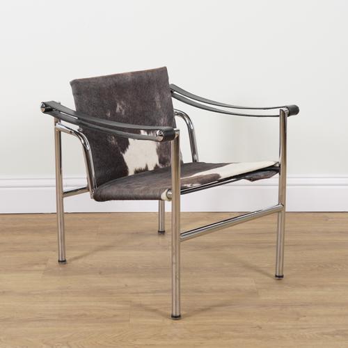 IN THE MANNER OF LE CORBUSIER LC1; A MID 20TH CENTURY CHROME AND PONY HAIR UPHOLSTERED ARMCHAIR