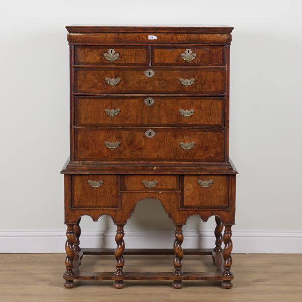 AN EARLY 18TH CENTURY FIGURED WALNUT NINE DRAWER CHEST ON STAND