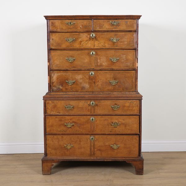 A GEORGE II FIGURED WALNUT CHEST ON CHEST