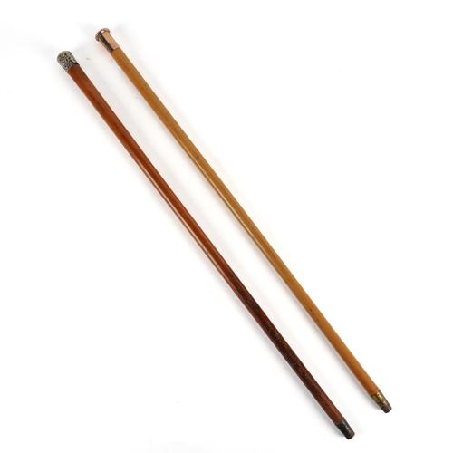 A GOLD-MOUNTED MALACCA WALKING CANE AND A SILVER-MOUNTED CANE (2)