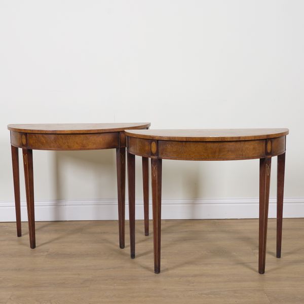 A PAIR OF GEORGE III STYLE MARQUETRY INLAID FIGURED WALNUT DEMI-LUNE CONSOLE TABLES (2)