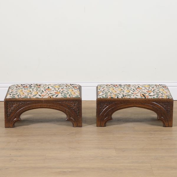 A PAIR OF VICTORIAN AND LATER GOTHIC REVIVAL RECTANGULAR FOOTSTOOLS (2)