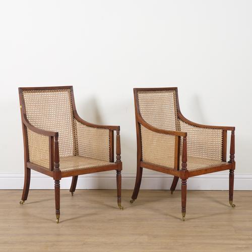 A PAIR OF REGENCY MAHOGANY FRAMED LIBRARY BERGERE CHAIRS (2)