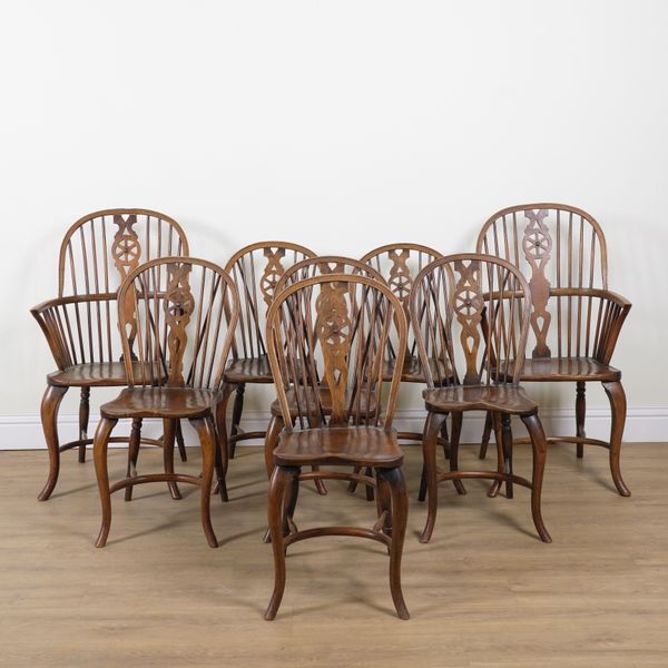 A SET OF EIGHT ELM SEATED WHEEL BACK KITCHEN CHAIRS (8)