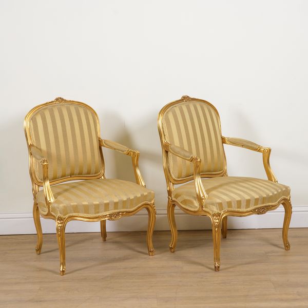 A PAIR OF LOUIS XV STYLE GILT FRAMED OPEN ARMCHAIRS (2)