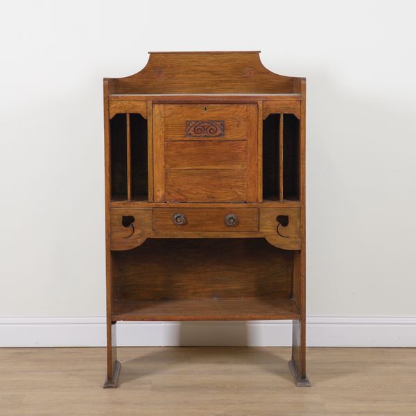 AN ART NOVEAU OAK CABINET