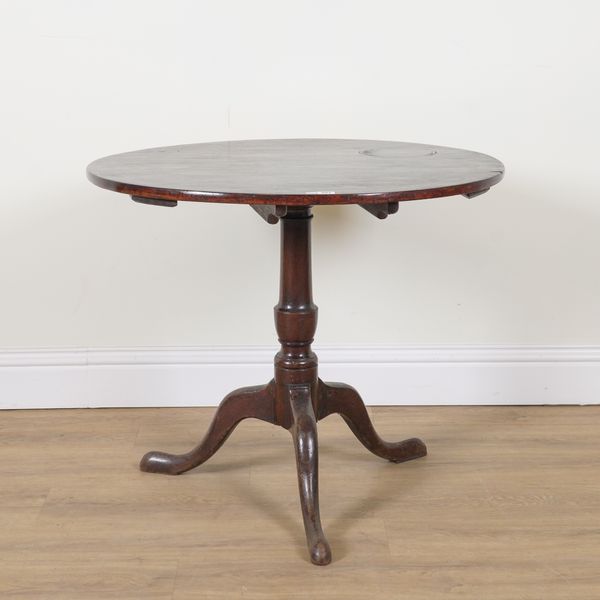 A MID 18TH CENTURY MAHOGANY CIRCULAR SNAP TOP OCCASIONAL TABLE