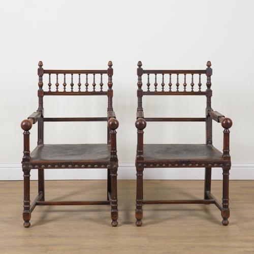 A PAIR OF 19TH CENTURY CONTINENTAL OAK FRAMED OPEN ARMCHAIRS (2)