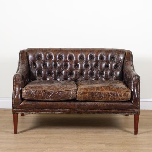 A 20TH CENTURY BROWN BUTTONBACK LEATHER UPHOLSTERED TWO SEAT SOFA
