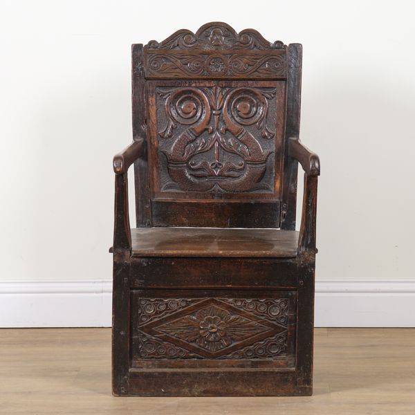 A 17TH CENTURY AND LATER OAK WAINSCOT OPEN ARMCHAIR