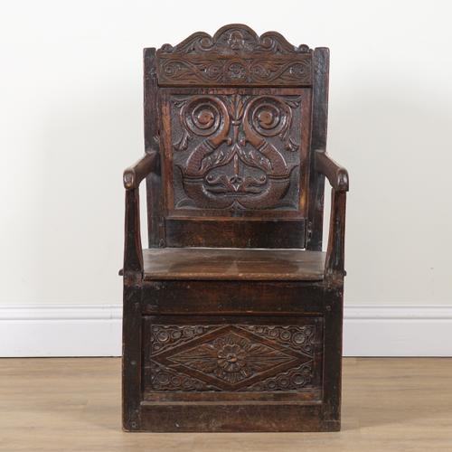 A 17TH CENTURY AND LATER OAK WAINSCOT OPEN ARMCHAIR