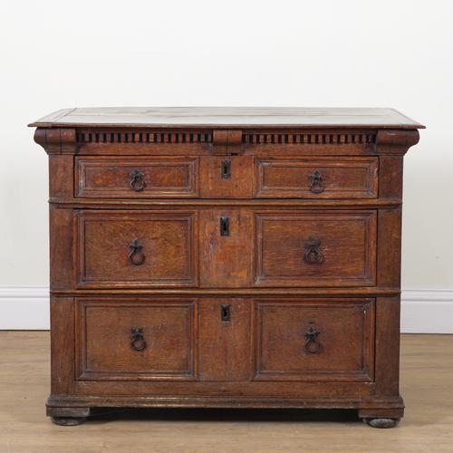 A CHARLES II OAK THREE DRAWER CHEST OF DRAWERS