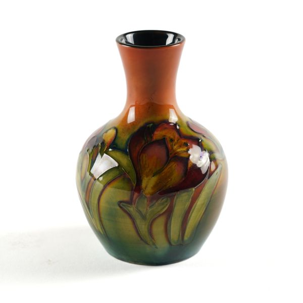 A SMALL MOORCROFT FLAMBE GLAZED VASE