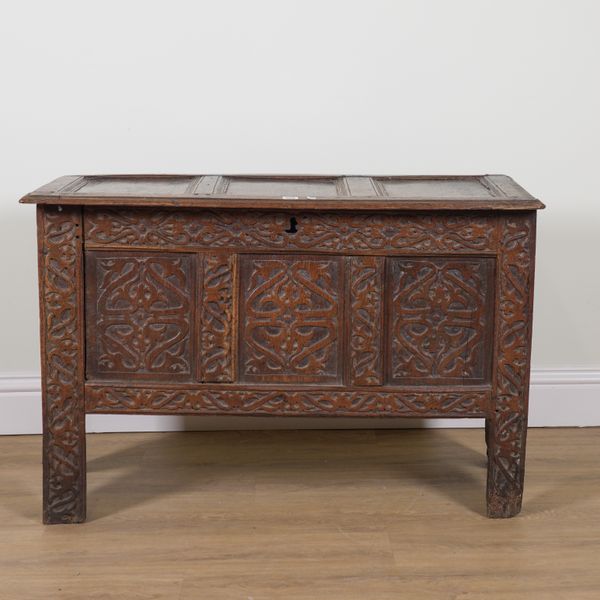 A LATE 17TH CENTURY CARVED OAK PANEL COFFER