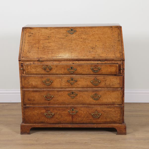 A GEORGE III BURR ELM FOUR DRAWER BUREAU