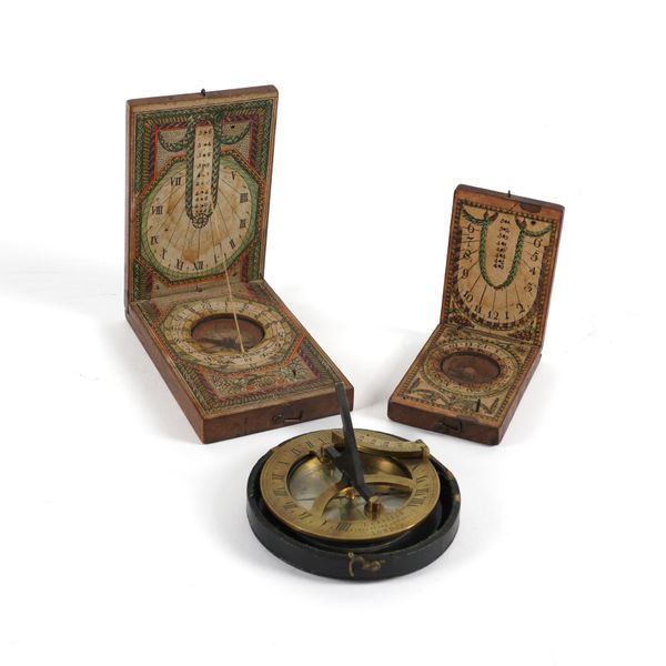 TWO CONTINENTAL PEARWOOD AND PAPER POCKET COMPASS-SUNDIALS (3)