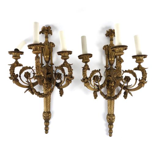 A PAIR OF LOUIS XVI STYLE GILT-BRONZE THREE LIGHT WALL APPLIQUES (2)