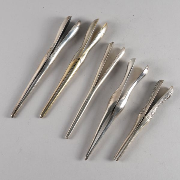 FOUR PAIRS OF SILVER GLOVE STRETCHERS AND ONE FOREIGN PAIR (5)