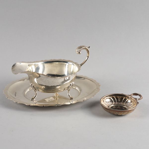 A SILVER SAUCEBOAT AND STAND AND A SILVER TASSE DE VIN (3)